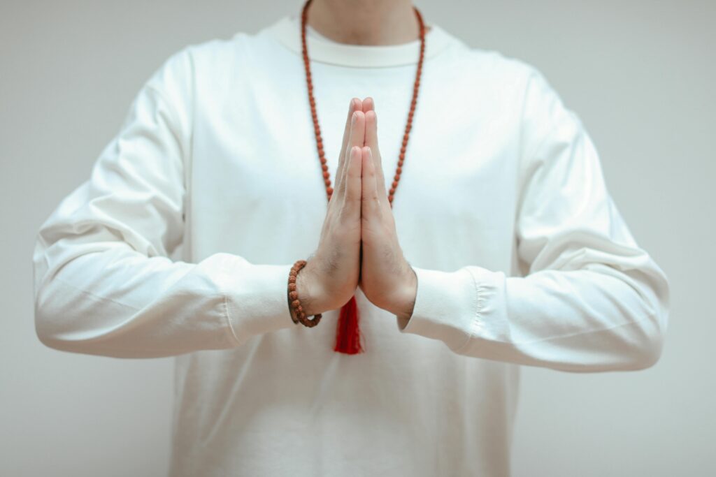 Close-up of hands in Anjali Mudra, symbolizing peace and mindfulness.