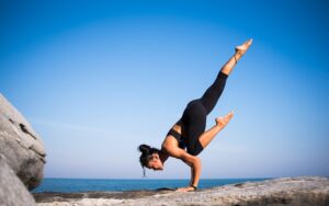 yoga, strength, woman, balance, balancing, nature, fit, fitness, young woman, fit woman, wellness, pose, yoga pose, posing, strength training, meditation, health, outdoors, beach, international yoga day